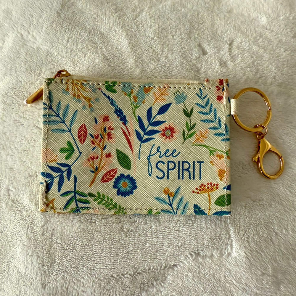 Cute ID/card keychain. Cream colored background with flowers “free spirit”